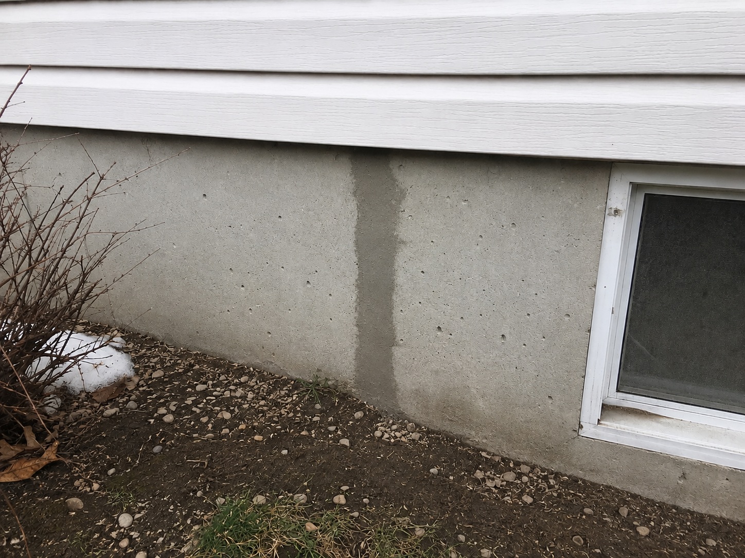 Polyurethane injection sealing a leaking poured-concrete foundation crack
